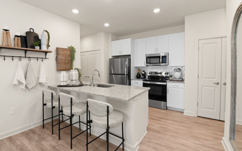 a kitchen with white cabinets