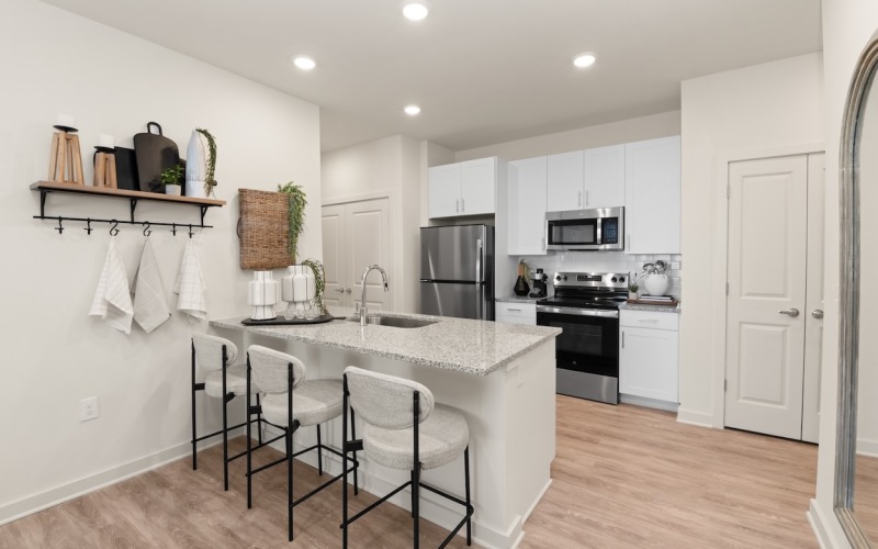 a kitchen with white cabinets