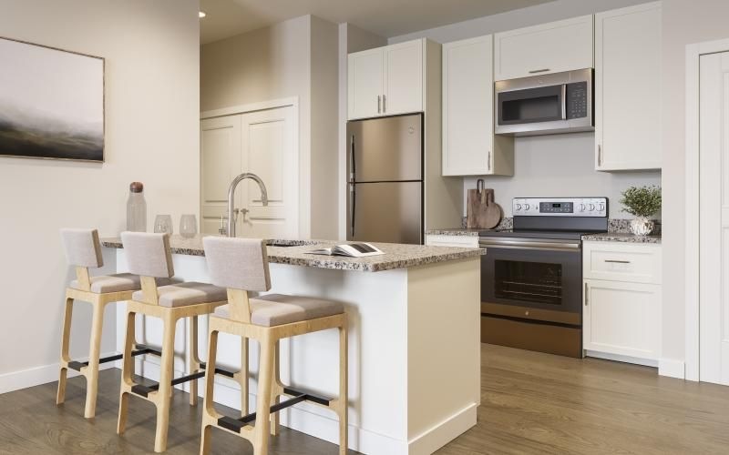 a kitchen with white cabinets
