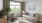 a living room with a fan and couches
