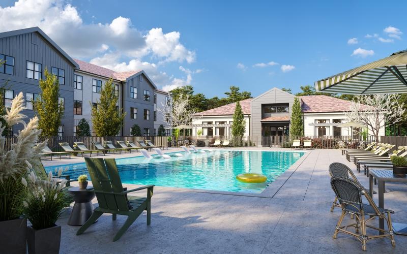a swimming pool with chairs around it